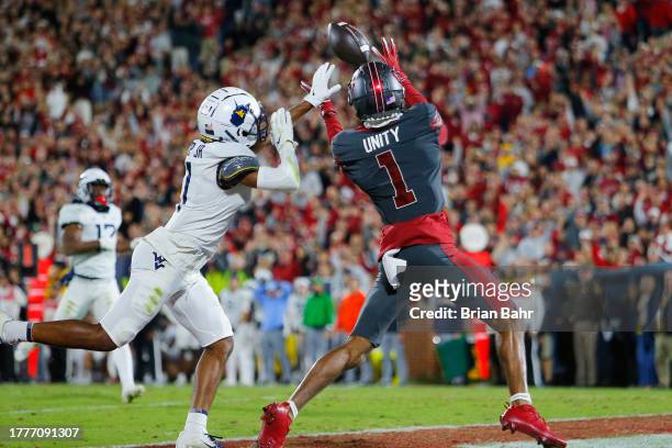 Wide receiver Jayden Gibson of the Oklahoma Sooners catches a 32-yard pass for a touchdown against cornerback Beanie Bishop Jr. #11 of the West...
