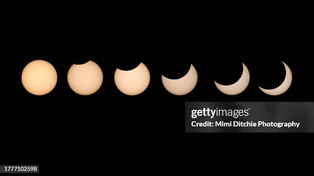 progression of the partial solar eclipse - eclipse solar imagens e fotografias de stock