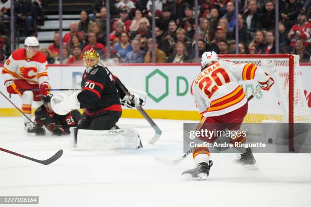 Blake Coleman of the Calgary Flames scores a second period goal against Joonas Korpisalo of the Ottawa Senators at Canadian Tire Centre on November...