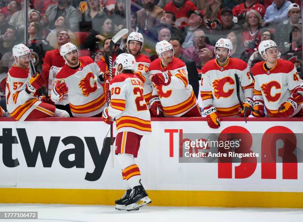Blake Coleman of the Calgary Flames celebrates his second period goal against the Ottawa Senators with teammates at the players' bench at Canadian...