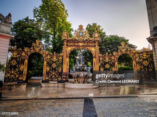 gilded ornated fountain of amphitrite at the place stanislas (stanislaw square), nancy, meurthe et moselle, lorraine, eastern france. - stanislas stock pictures, royalty-free photos & images