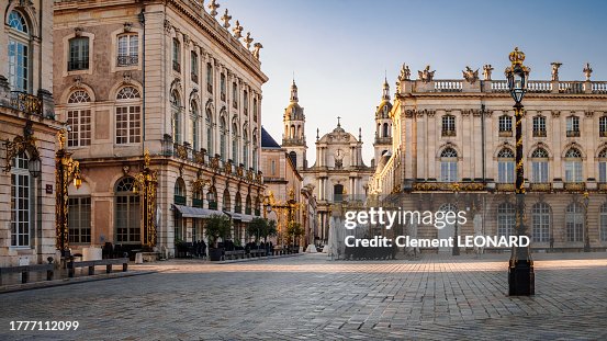 Place Stanislas (Stanislaw Square) south-east corner with a perspective on the Our Lady of the Annunciation (Notre-Dame-de-l’Annonciation) cathedral between cafes and the town hall, Nancy, Meurthe et Moselle, Lorraine, Eastern France.