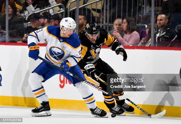 Evgeni Malkin of the Pittsburgh Penguins and Jeff Skinner of the Buffalo Sabres battle at PPG PAINTS Arena on November 11, 2023 in Pittsburgh,...
