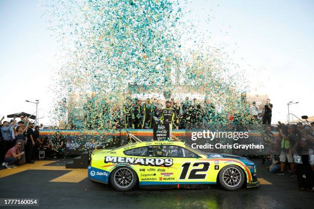 Ryan Blaney, driver of the Menards/Dutch Boy Ford, celebrates in victory lane after winning the 2023 NASCAR Cup Series Championship, finishing first...