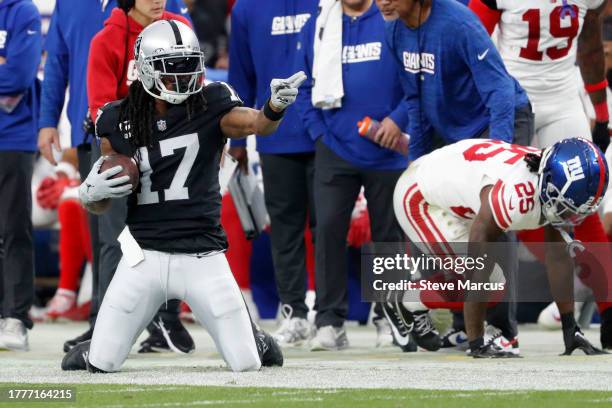 Davante Adams of the Las Vegas Raiders reacts after a catch in the third quarter of a game against the New York Giants at Allegiant Stadium on...