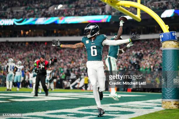 Brown of the Philadelphia Eagles celebrates after a touchdown with DeVonta Smith during the second half in the game against the Dallas Cowboys at...