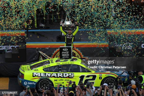 Ryan Blaney, driver of the Menards/Dutch Boy Ford, celebrates in victory lane after winning the 2023 NASCAR Cup Series Championship, finishing first...