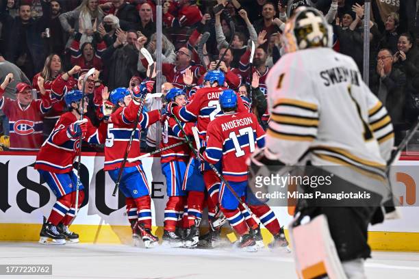 The Montreal Canadiens celebrate an overtime victory against the Boston Bruins at the Bell Centre on November 11, 2023 in Montreal, Quebec, Canada....