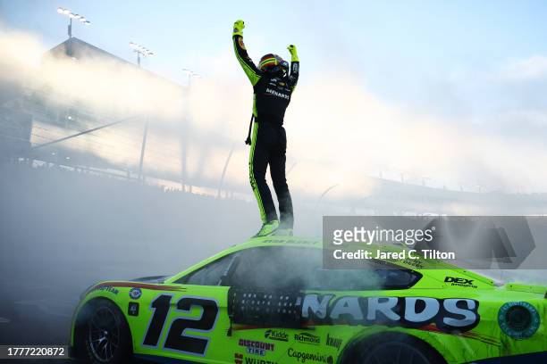 Ryan Blaney, driver of the Menards/Dutch Boy Ford, celebrates after winning the 2023 NASCAR Cup Series Championship, finishing first of the...