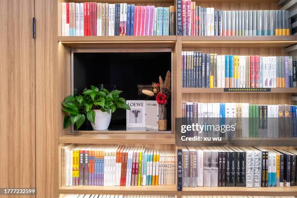 rows of wooden bookcases in the library - mensola per libri foto e immagini stock