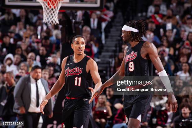 Malcolm Brogdon and Jerami Grant of the Portland Trail Blazershigh five during the game against the Memphis Grizzlies during the In-Season Tournament...