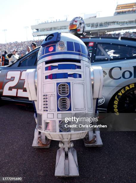 Replica R2-D2 droid os seen next to a Star Wars-themed wrap on the Columbia Sportswear Company Toyota, driven by Bubba Wallace on the grid prior to...