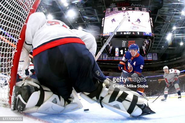 Hunter Shepard of the Washington Capitals makes a save against Brock Nelson of the New York Islanders during the second period at UBS Arena on...