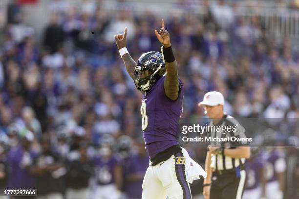 Lamar Jackson of the Baltimore Ravens celebrates after passing for a touchdown during an NFL football game between the Baltimore Ravens and the...