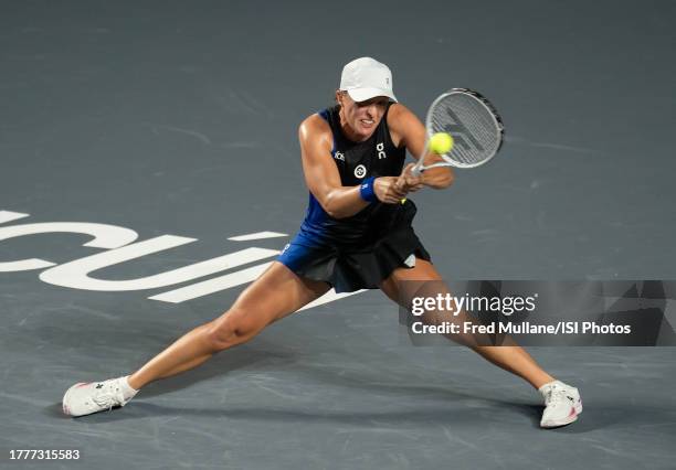 Iga Swiatek of Poland hits the ball to Aryna Sabalenka of Belarus on Day 8 of the GNP Seguros WTA Finals Cancun 2023 part of the Hologic WTA Tour at...