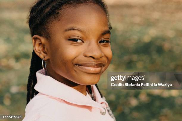 beautiful little girl in nature - braiding hairstyles for little black girls stock pictures, royalty-free photos & images