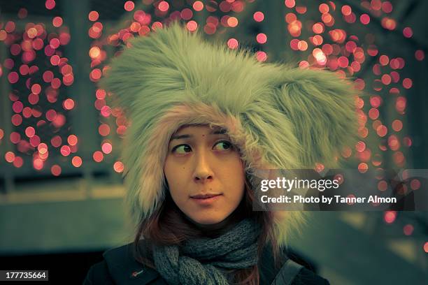cosplay girl wears furry hat with pink lights - cosplay in harajuku stock pictures, royalty-free photos & images