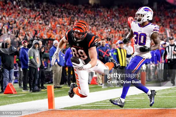 Drew Sample of the Cincinnati Bengals scores a touchdown reception past Dane Jackson of the Buffalo Bills during the second quarter at Paycor Stadium...