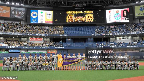 Hanshin Tigers players celebrate winning the Japan champions following the team's 7-1 victory in the Japan Series Game Seven at Kyocera Dome Osaka on...