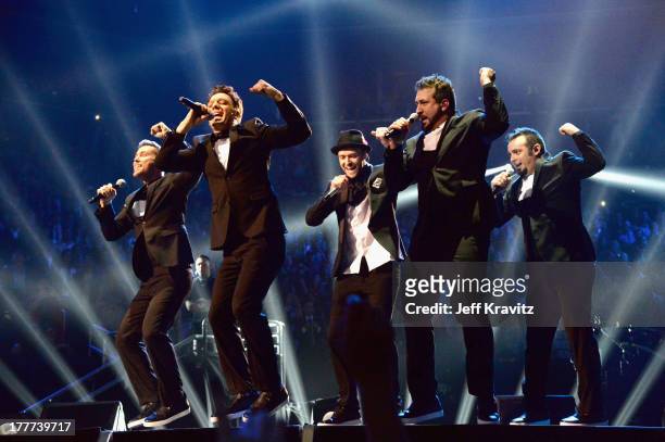 Lance Bass, JC Chasez, Justin Timberlake, Joey Fatone and Chris Kirkpatrick of N Sync perform during the 2013 MTV Video Music Awards at the Barclays...