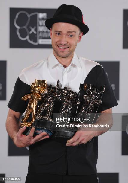 Justin Timberlake poses with Video of the Year award, Best Direction award, Best Editing award and Michael Jackson Video Vanguard award in the press...