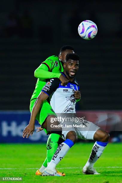 Moises Castillo of Juarez fights for the ball with Jose Zuniga of Queretaro during the 16th round match between FC Juarez and Queretaro as part of...