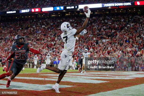 Wide receiver Traylon Ray of the West Virginia Mountaineers gets his hand on a pass but can't hold on in the end zone against defensive back Kani...