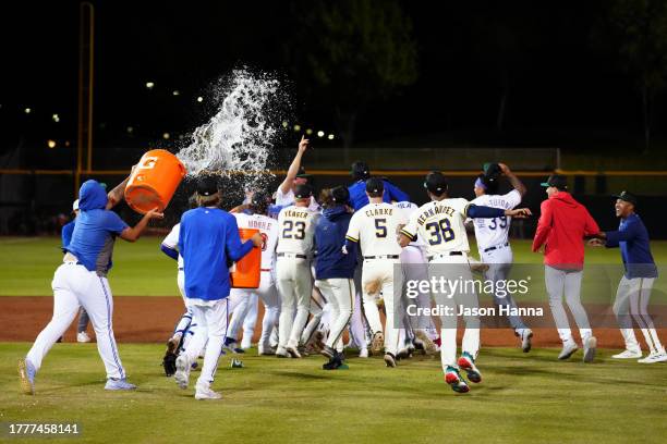 Members of the Surprise Saguaros celebrate on the field after the Saguaros defeated the Peoria Javelinas in the 2023 Arizona Fall League Championship...