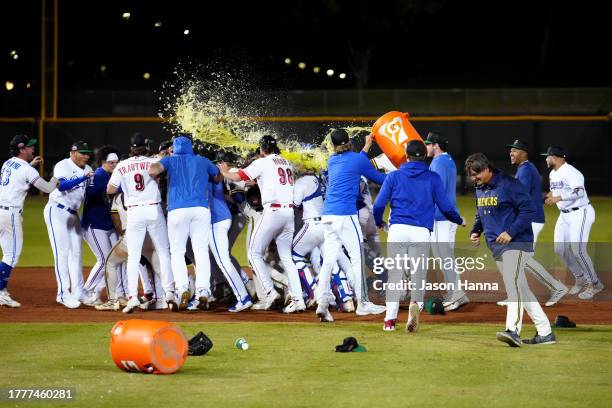 Members of the Surprise Saguaros celebrate on the field after the Saguaros defeated the Peoria Javelinas in the 2023 Arizona Fall League Championship...