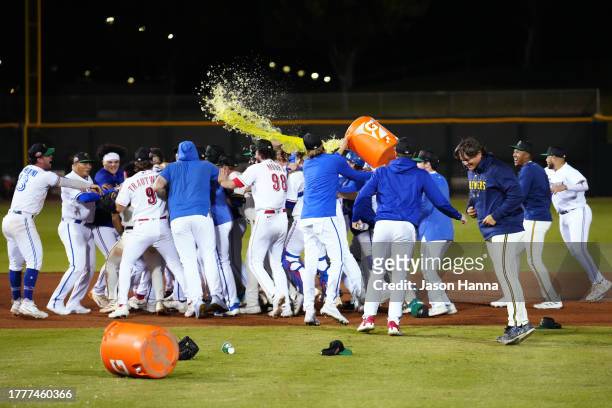 Members of the Surprise Saguaros celebrate on the field after the Saguaros defeated the Peoria Javelinas in the 2023 Arizona Fall League Championship...