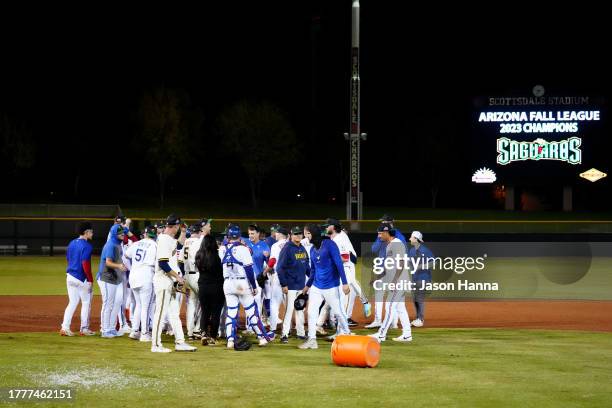 Members of the Surprise Saguaros celebrate on the field after the Saguaros defeated the Peoria Javelinas in the 2023 Arizona Fall League Championship...