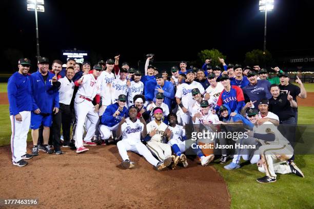 Members of the Surprise Saguaros pose for a team photo on the field after the Saguaros defeated the Peoria Javelinas in the 2023 Arizona Fall League...