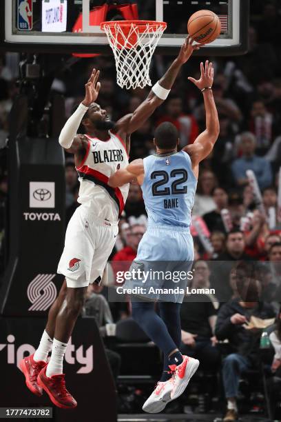 Deandre Ayton of the Portland Trail Blazers blocks a shot by Desmond Bane of the Memphis Grizzlies during the third quarter at Moda Center on...