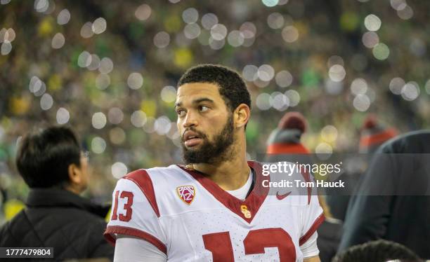 Quarterback Caleb Williams of the USC Trojans stands on the sideline during the first half against the Oregon Ducks at Autzen Stadium on November 11,...