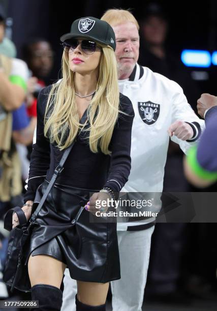 Recording artist Orianthi Panagaris and owner and managing general partner Mark Davis of the Las Vegas Raiders walk onto the field as the New York...