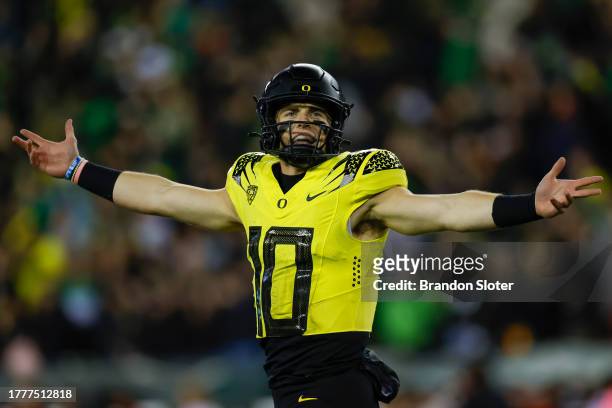 Bo Nix of the Oregon Ducks celebrates a touchdown pass in the first half during a game against the USC Trojans at Autzen Stadium on November 11, 2023...