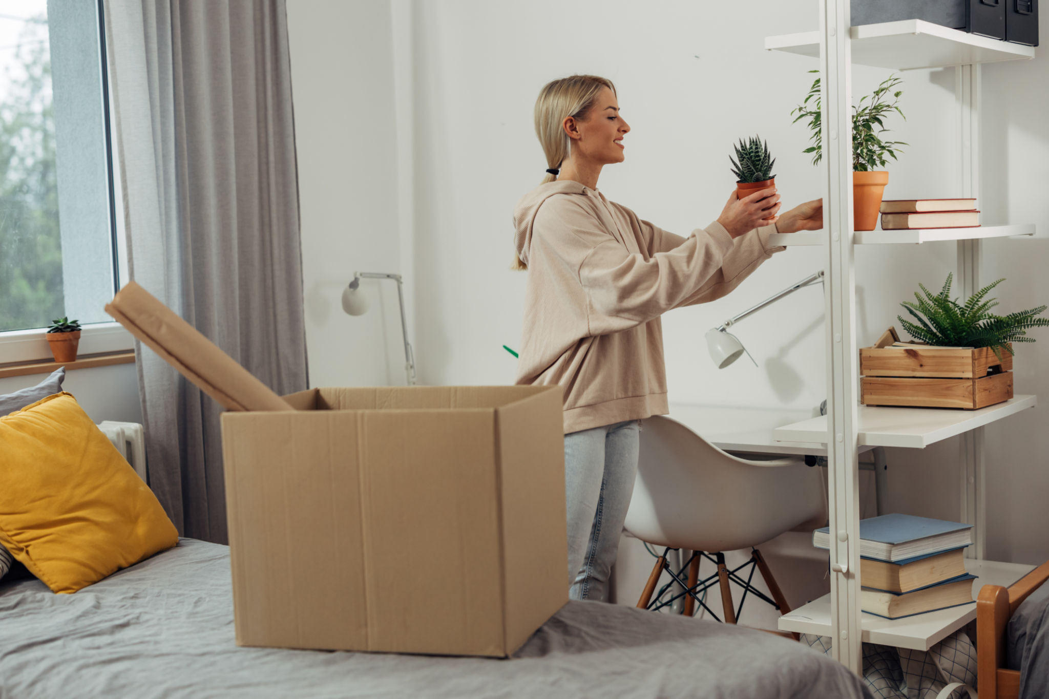 student moving boxes