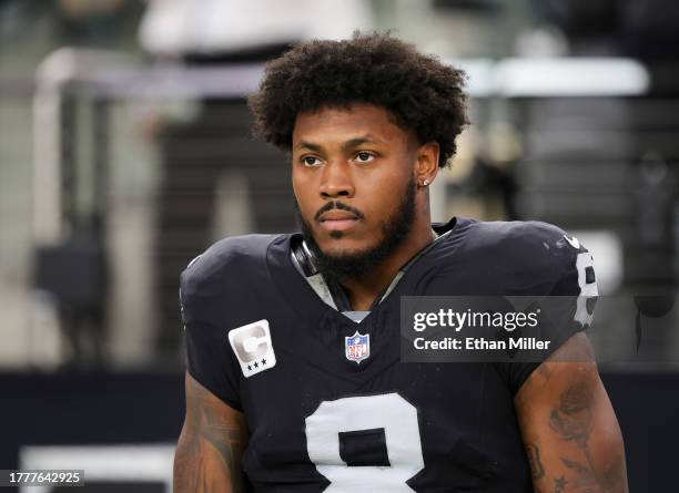 Running back Josh Jacobs of the Las Vegas Raiders looks on as the United States national anthem is performed before a game against the New York...