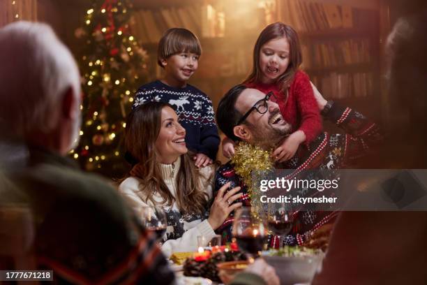 happy family enjoying in new year's dinner at grandparents'. - happy family stockfoto's en -beelden