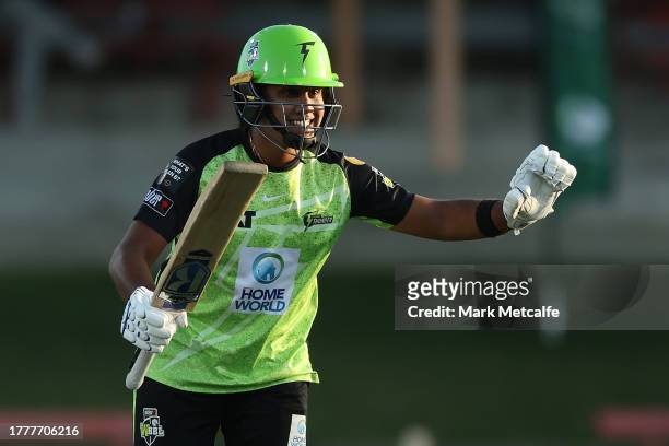 Chamari Athapaththu of the Thunder celebrates and acknowledges the crowd after scoring a half century during the WBBL match between Sydney Thunder...
