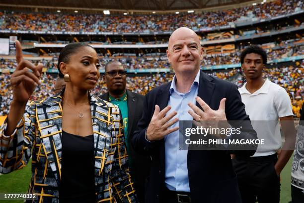 Jessica Motaung , marketing director of the Kaizer Chiefs Football Club and daughter of Kaizer Motaung gestures with President of the Confederation...