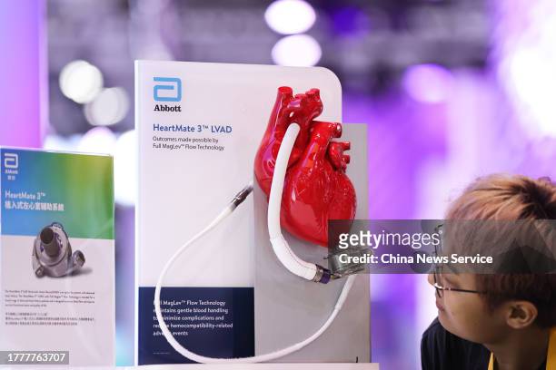 Visitor looks at HeartMate 3 LVAD, a mechanical circulatory support device for patients with advanced heart failure, during the 6th China...