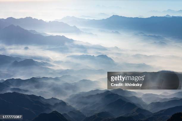 mountains in the morning on a foggy day - foggy landscape stock pictures, royalty-free photos & images