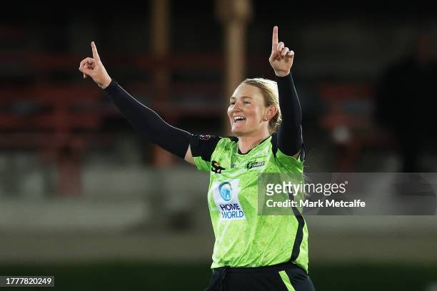 Sammy-Jo Johnson of the Thunder celebrates taking the wicket of Georgia Redmayne of the Heat during the WBBL match between Sydney Thunder and...