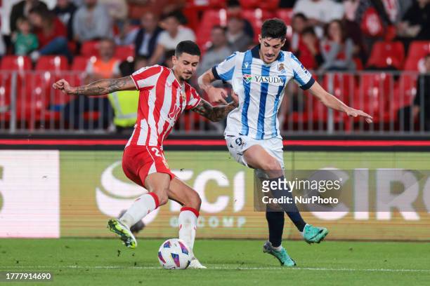 Carlos Fernandez of Real Sociedad compete for the ball with Juan Brandariz ''Chumi'' of UD Almeria during the La Liga EA Sports match between UD...