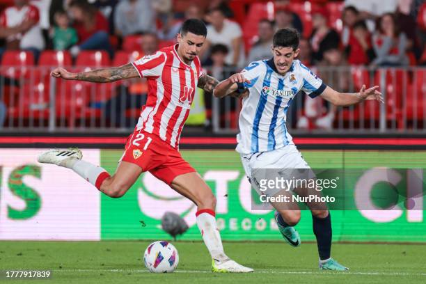 Juan Brandariz ''Chumi'' of UD Almeria compete for the ball with Carlos Fernandez of Real Sociedad during the La Liga EA Sports match between UD...
