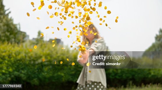 Woman exploding confetti Woman exploding confetti