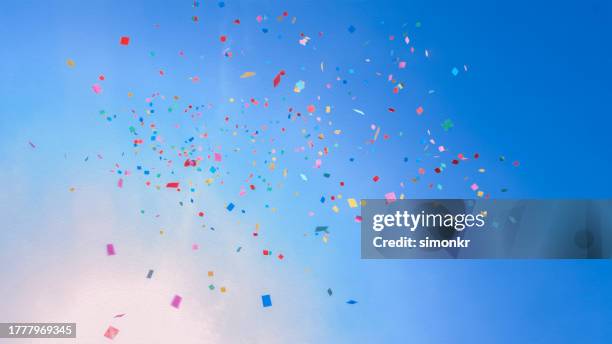 colourful confetti falling - party background stock pictures, royalty-free photos & images