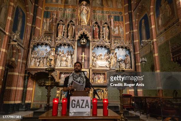 Alaa Minawi, A Palestinian activist saying the names of the Palestinian victims in Gaza during a prayer and vigil inside The Dominicus Church in...
