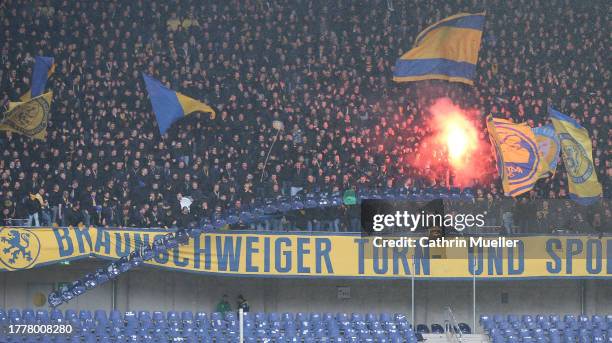 Supporter of Eintracht Braunschweig throw rows of seats from the stands during the Second Bundesliga match between Hannover 96 and Eintracht...